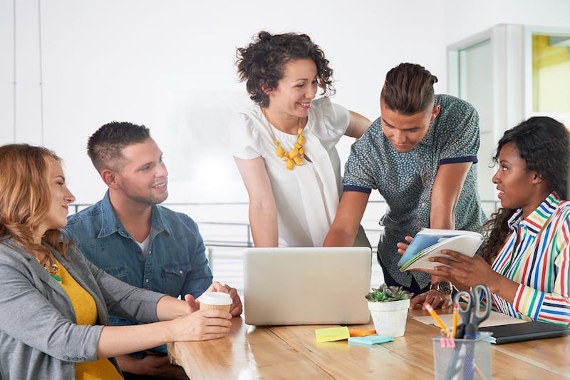 marketing consulting group discusses marketing strategies and plan with excited young business owners